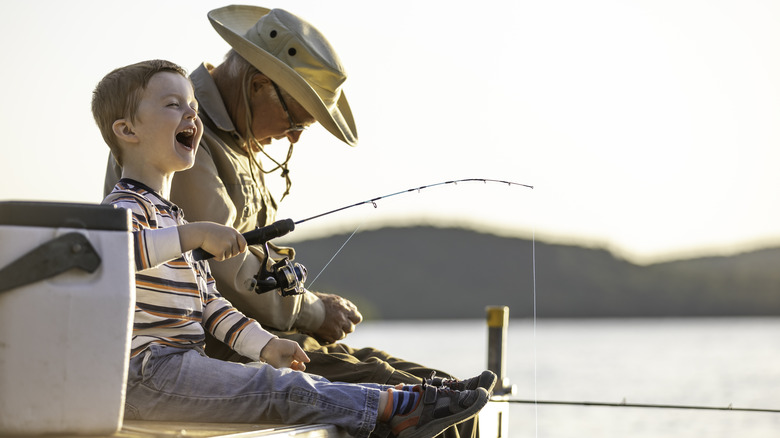 Grandfather and grandson fishing