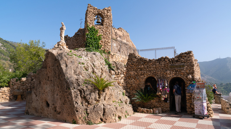 cobbled hermitage structure carved into rock in Mijas Pueblo Spain