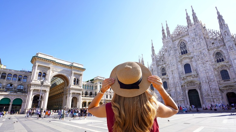 Woman in hat looking at cathedrals
