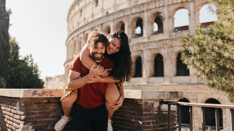 Couple in front of Roman Colosseum