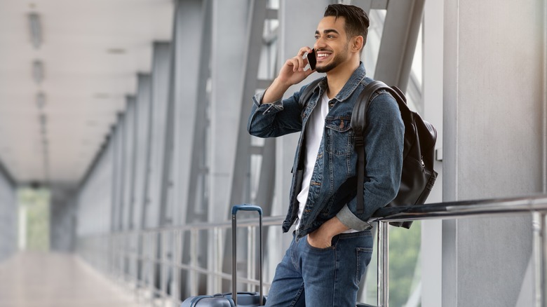 Man at airport on phone