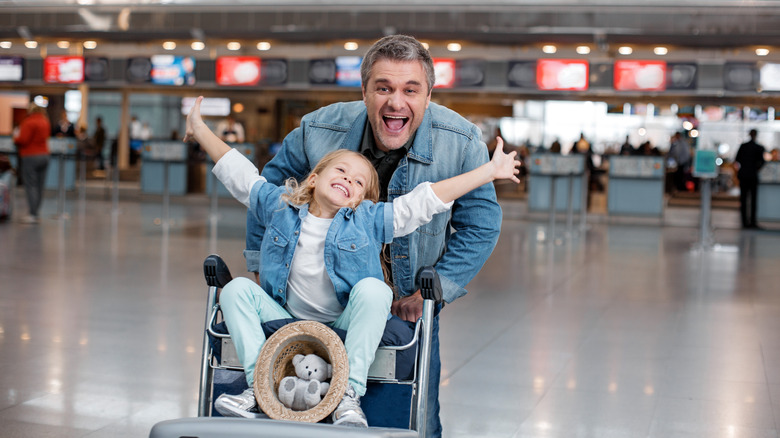 Dad and child in an airport