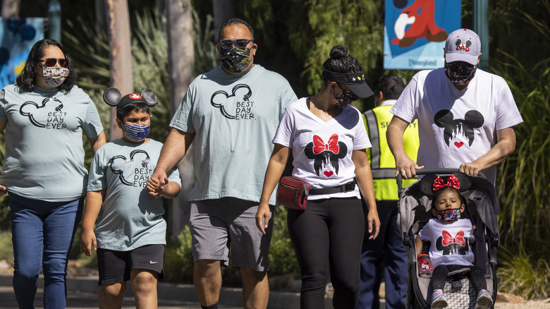 Family walking through Disneyland