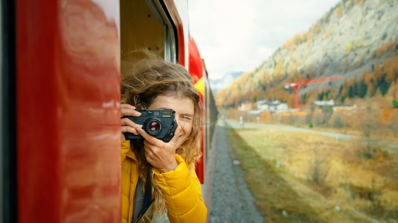 Woman looking out train window