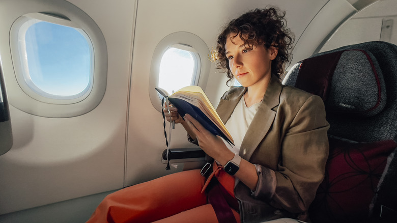 Woman reading on plane