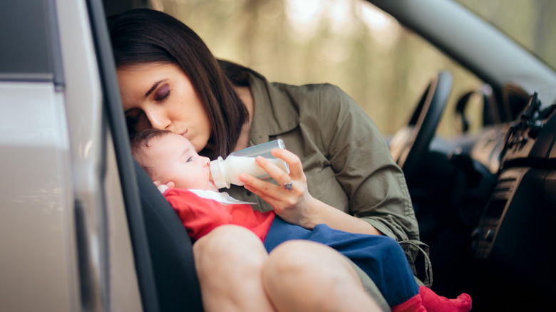 woman pulled over feeding baby
