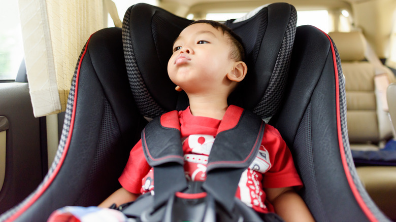 unhappy toddler in car seat