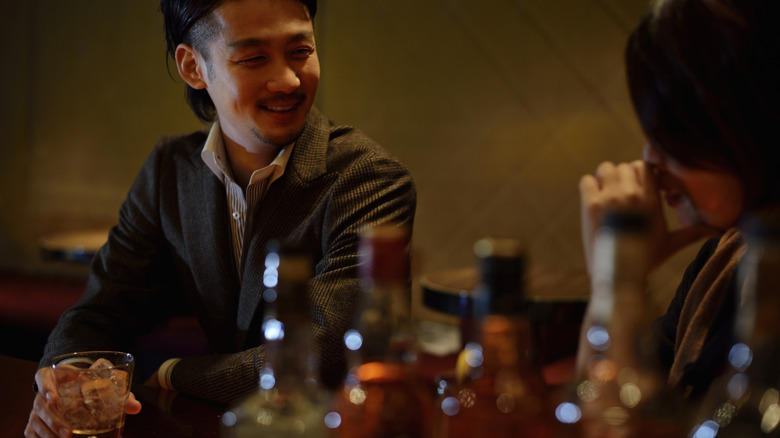 people talking in a bar in Japan