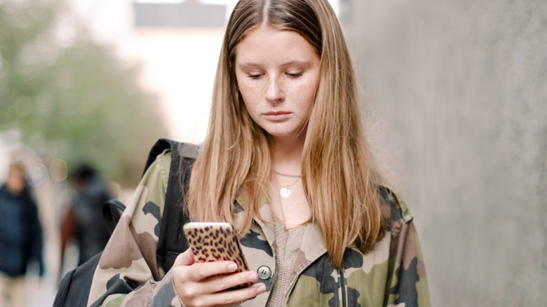 girl wearing a camo jacket