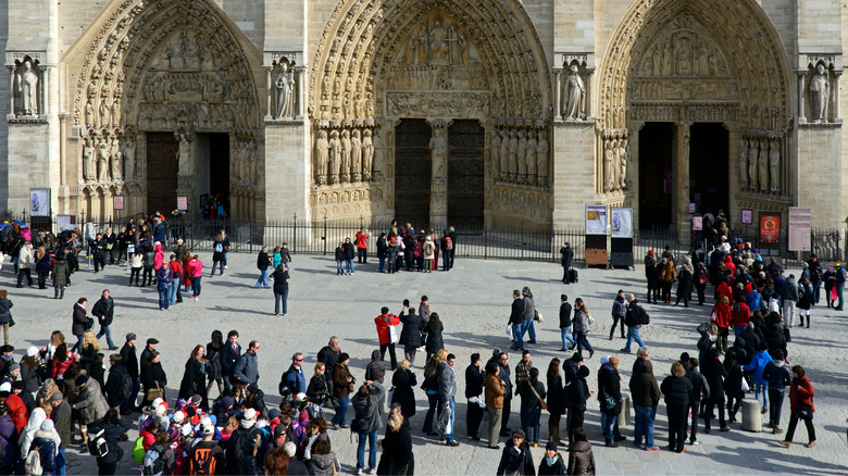 Tourists in line to visit Notre Dame cathedral in Paris.