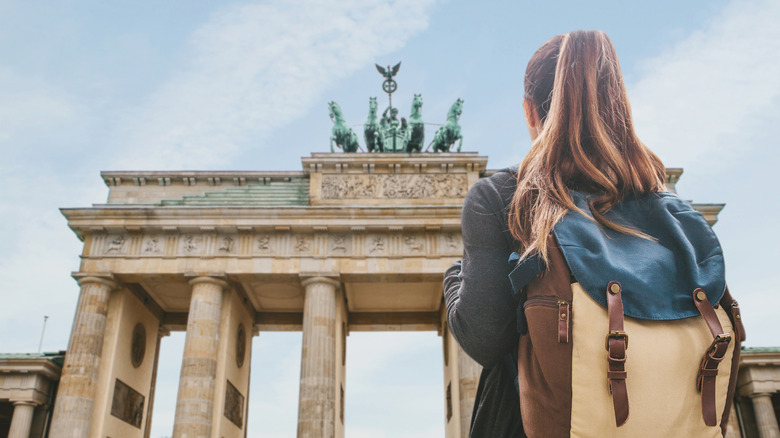 Tourist in front of Brandenburg Gate