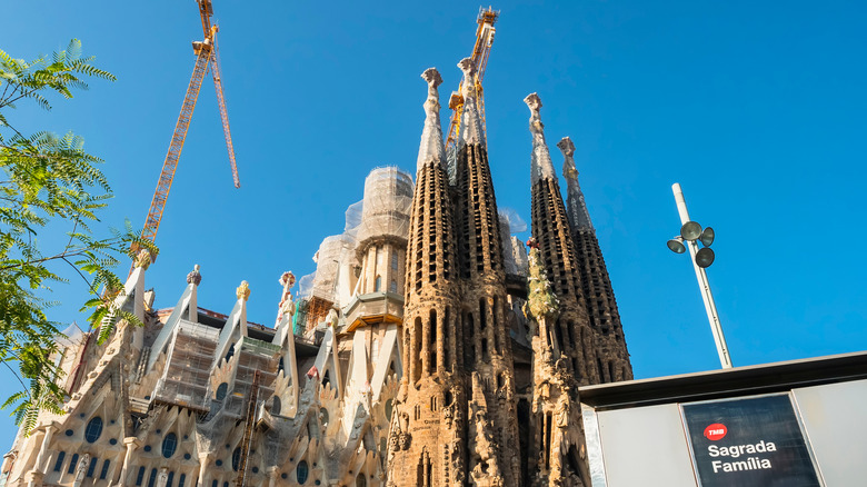 Sagrada Família construction with subway sign