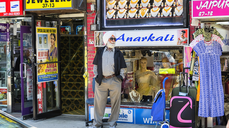 Man standing in Jackson Heights