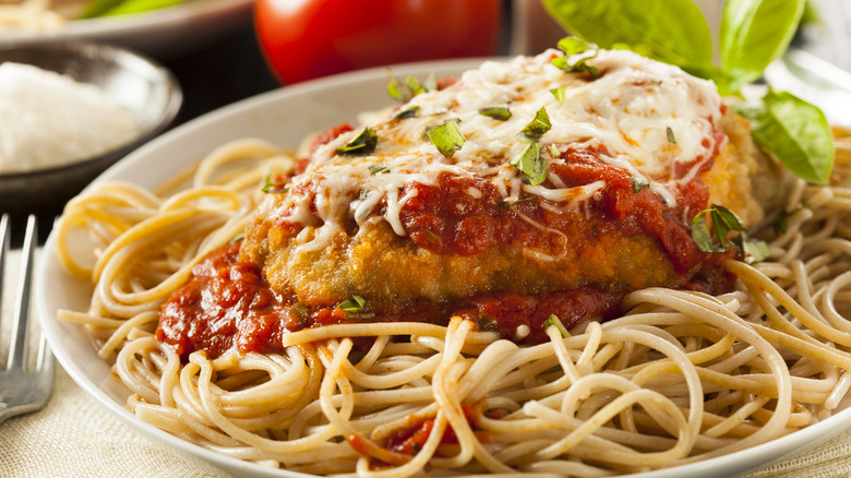 Chicken parmigiana on spaghetti