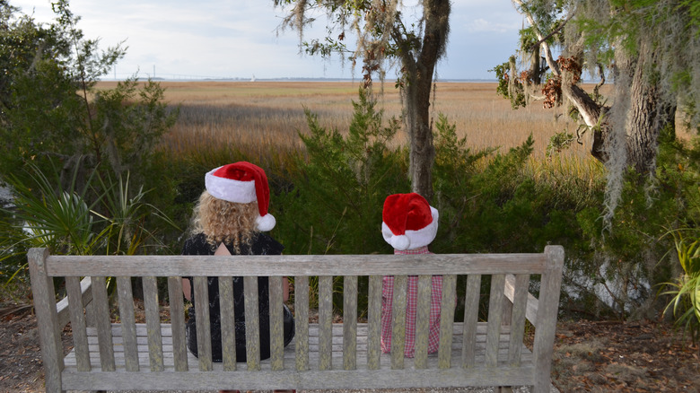 children with Santa hats by marsh