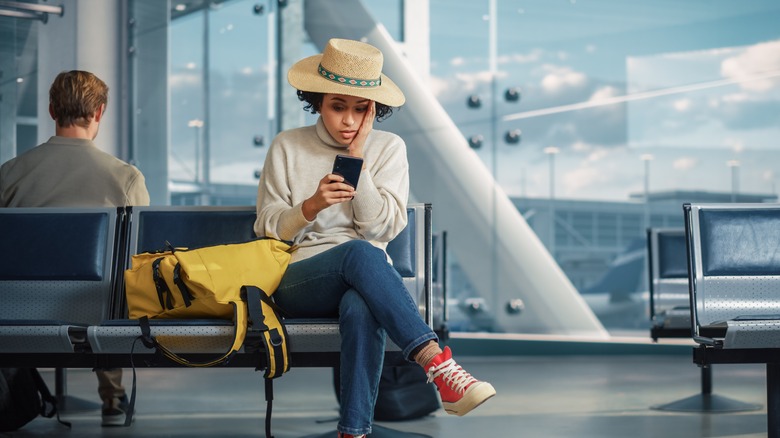 female traveler checking phone