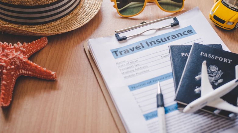 Travel insurance paperwork and passports