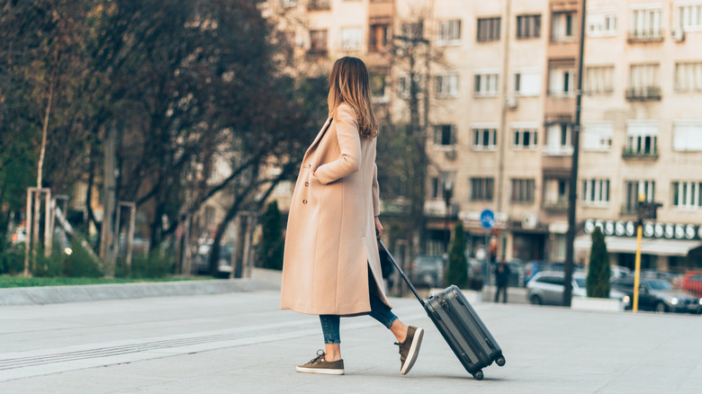 Woman walking on quiet road