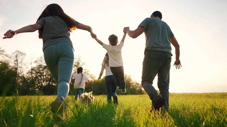 Family running in a park