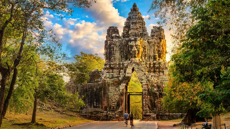 two bikers and stone temple gate