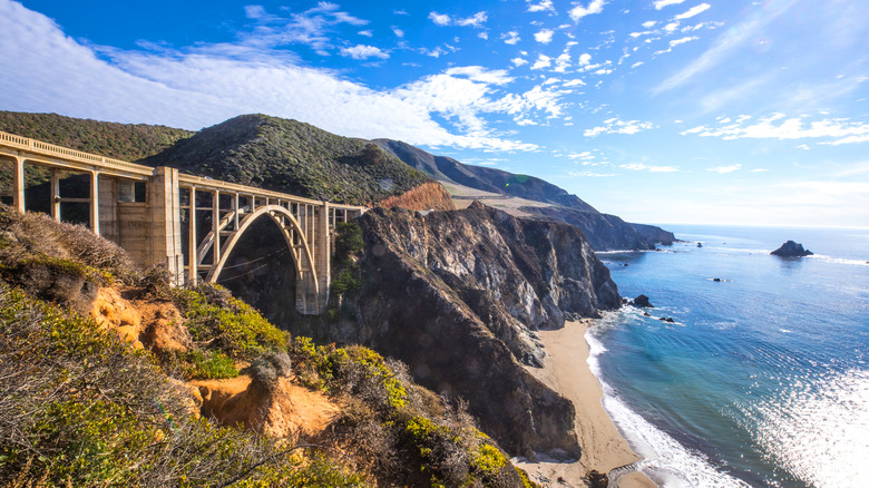 highway bridge on cliff over ocean