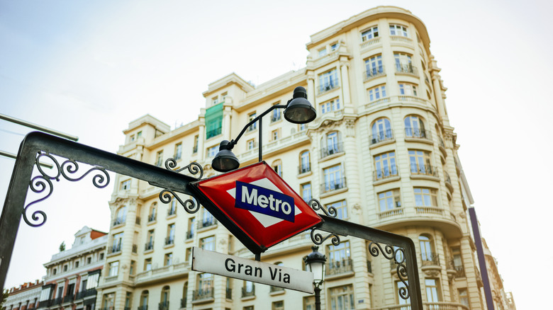 A street sign marks a Madrid metro station