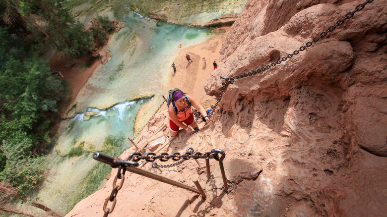 hikers descending to Mooney Falls