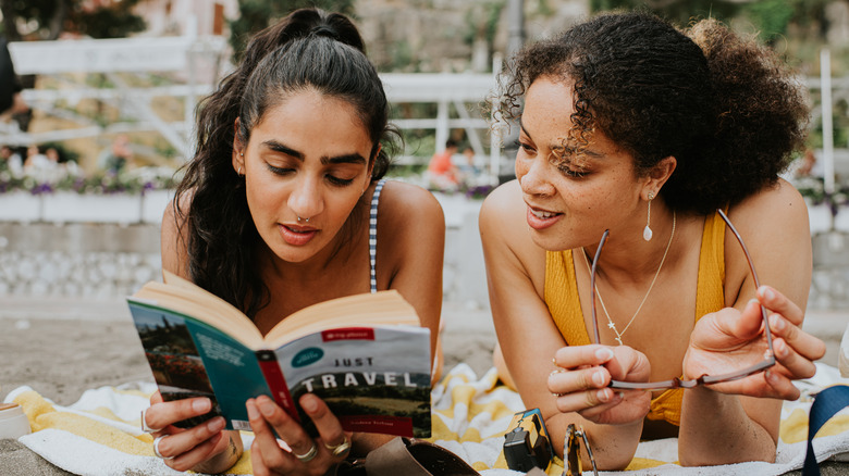 Tourists researching a guidebook