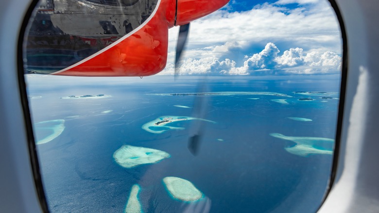 Seaplane flying over the Maldives