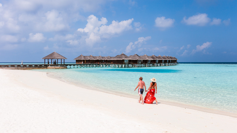 Couple walking along the beach