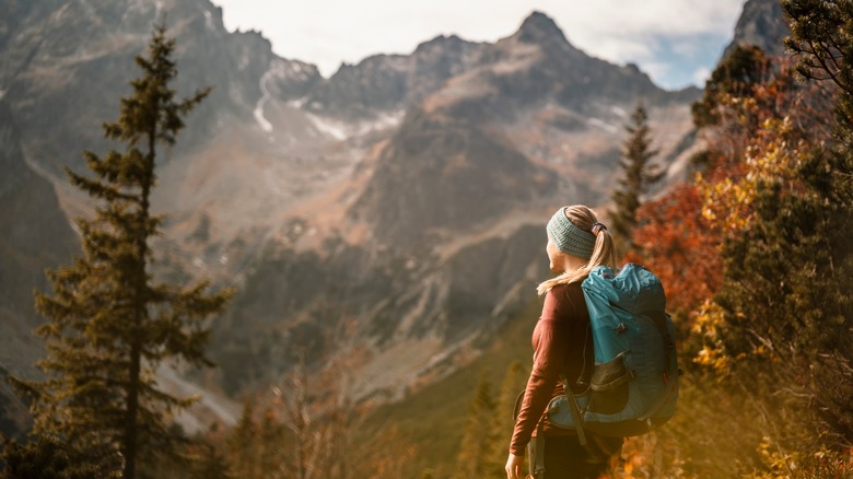 Hiker with backpack in fall
