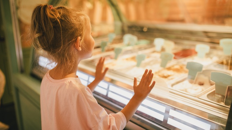 Girl looking at ice cream options