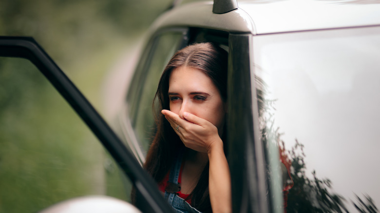 Car sick woman