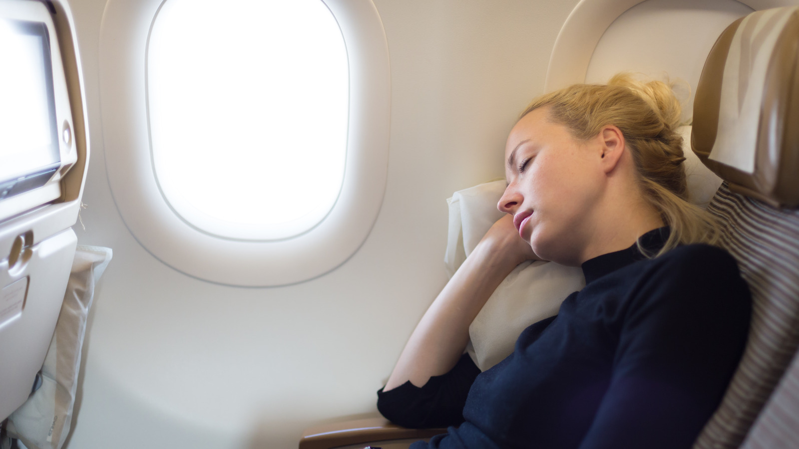 How to Lift the Armrest on Your Airplane Seat