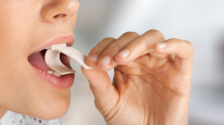 A woman chewing gum