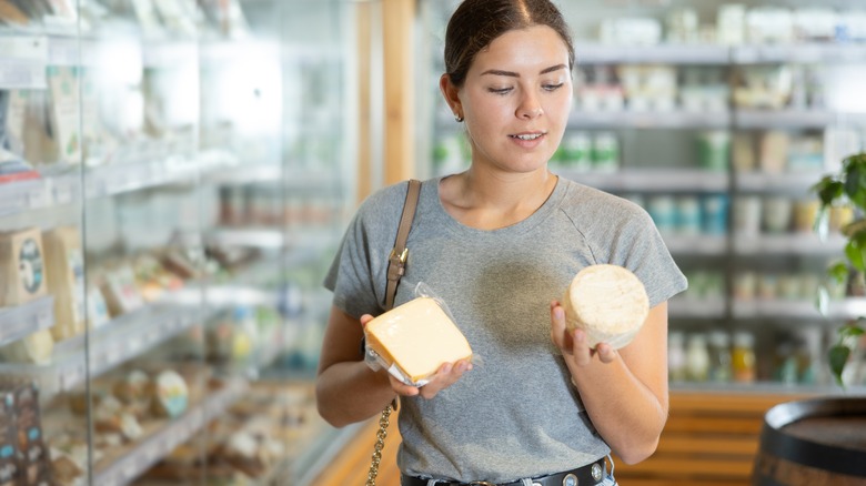 Woman shopping for cheese