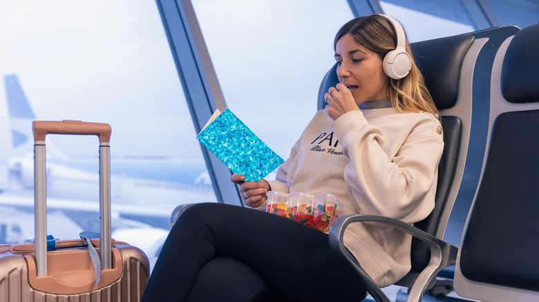 Traveler eating candy at airport