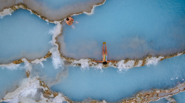 Aerial view of swimmers in Italy's Saturnia Hot Springs