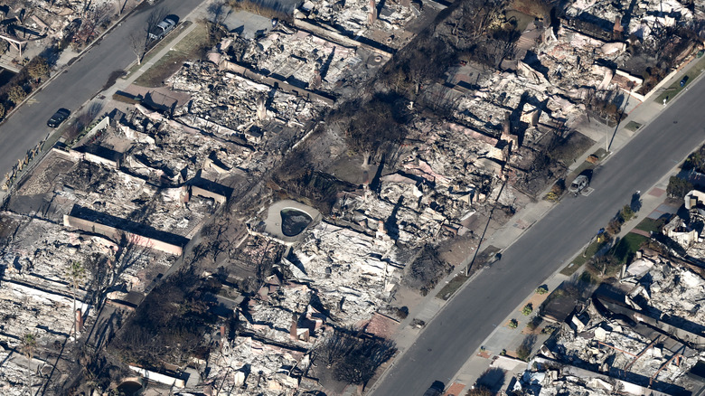 an aerial view of homes destroyed in the Pacific Palisades California wildfire