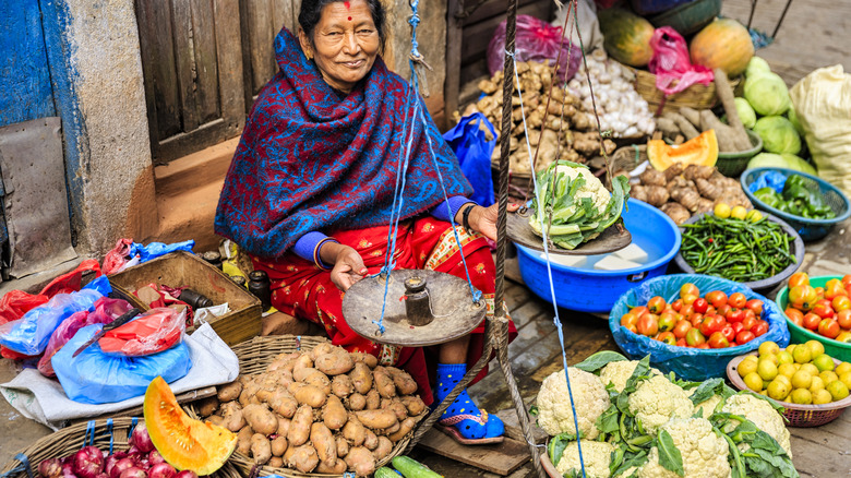 woman selling produce in Nepal
