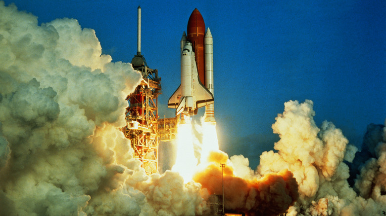 Rocket launch under blue sky