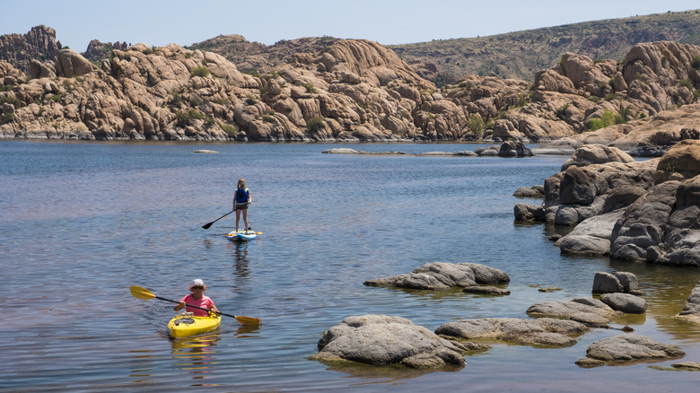 Boaters exploring rocky lake
