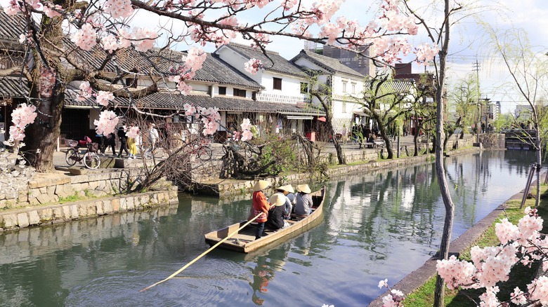 A group rides a boat in Kurashiki