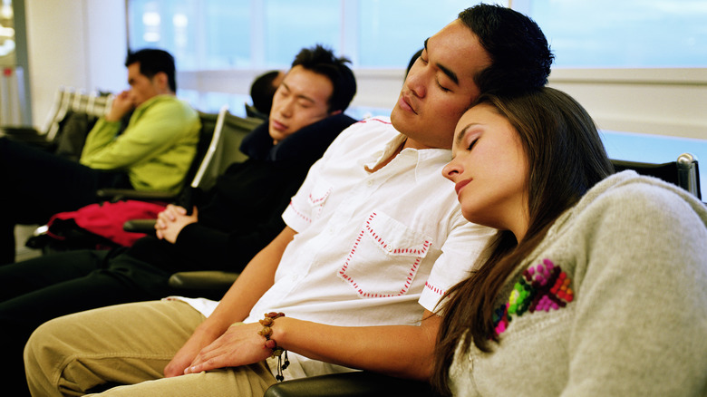 People sleeping in airport