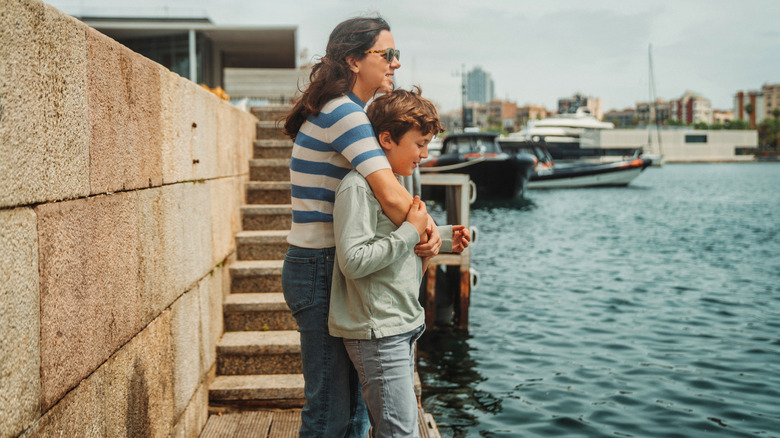 mother and son near seaport