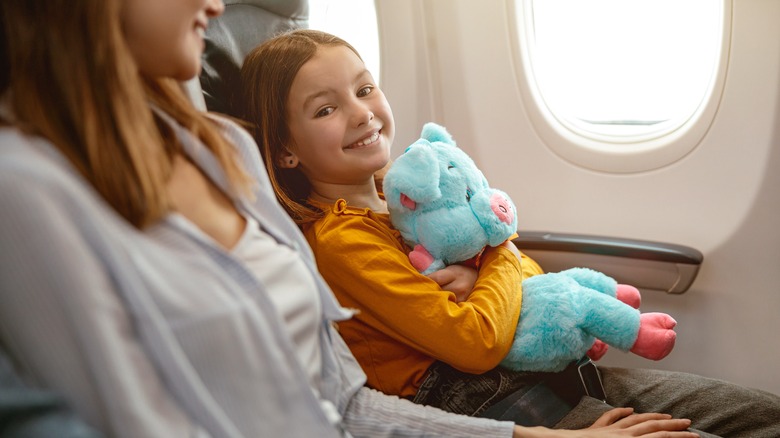 girl flying with stuffed animal