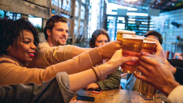 Friends enjoying round of beers