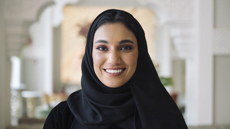 Muslim woman smiling at camera 
