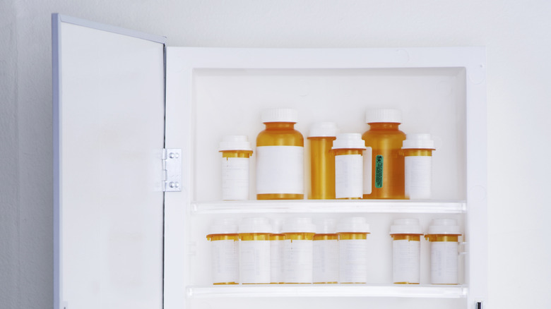 Pill bottles inside medicine cabinet