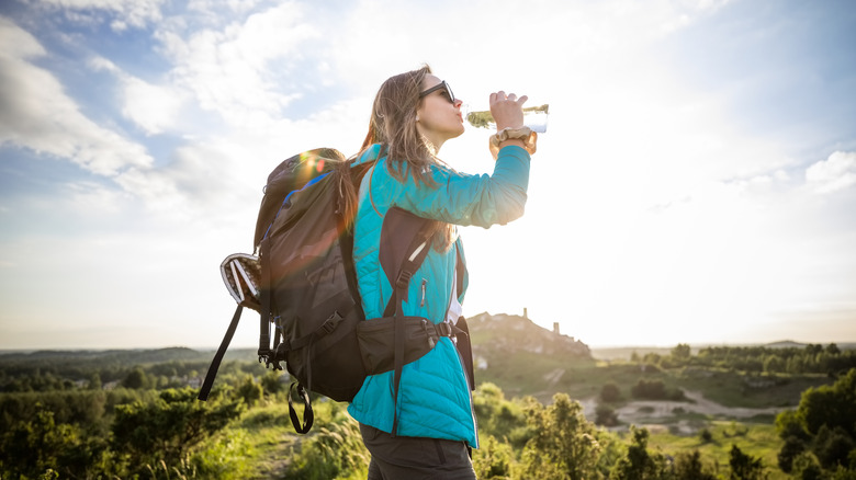 Hiker drinking from water bottle